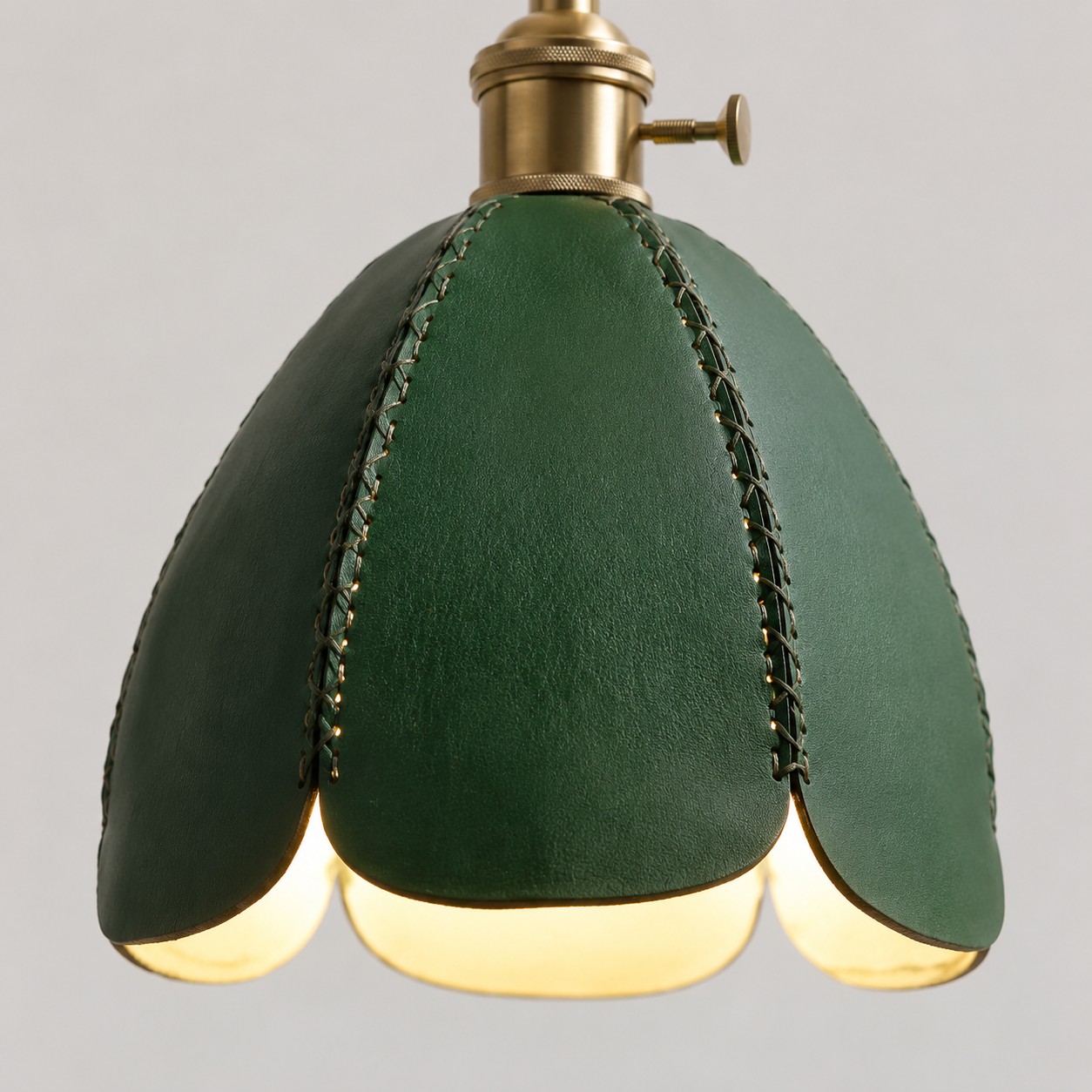 Green leather scalloped shade detail on pendant light