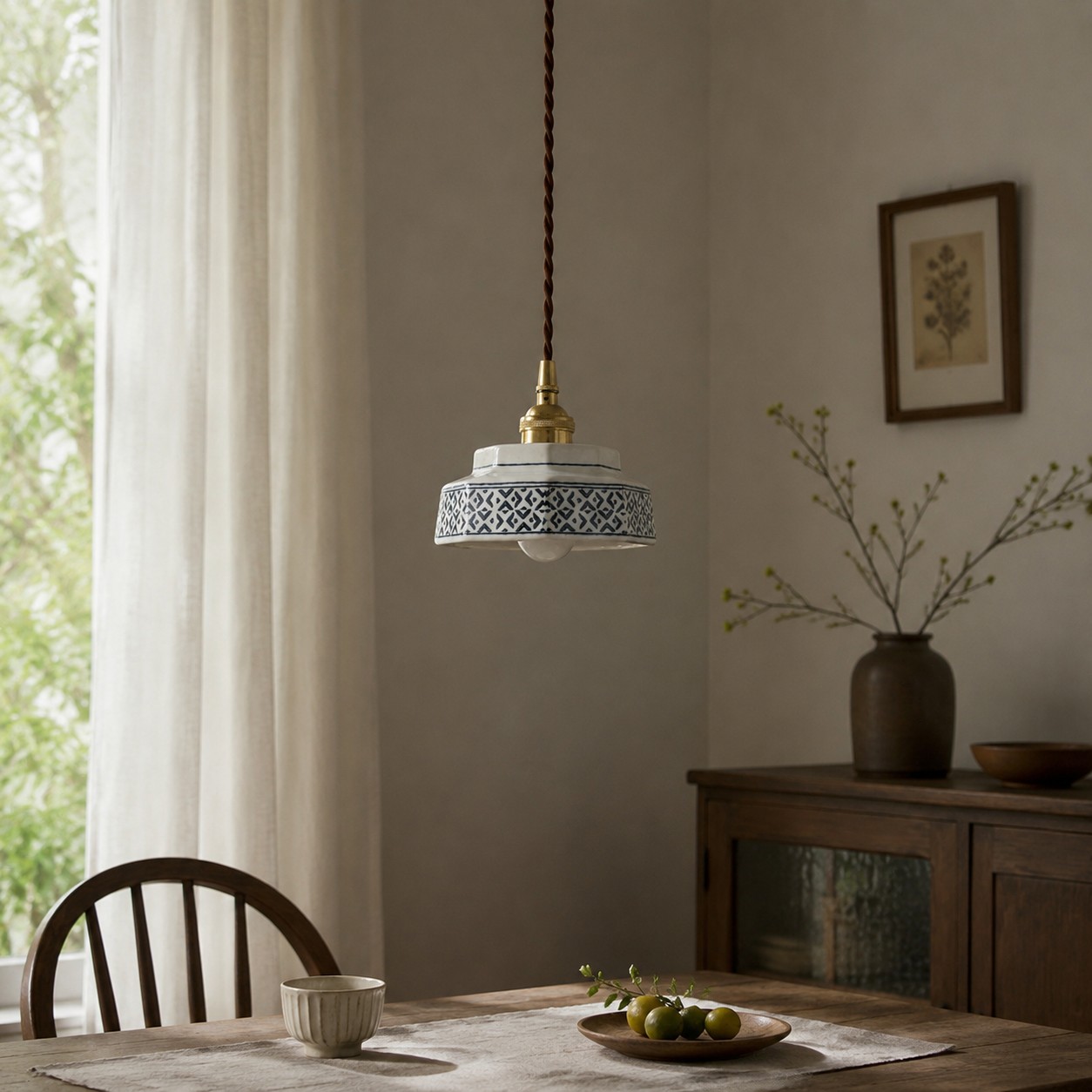 blue floral ceramic pendant light in a dining room