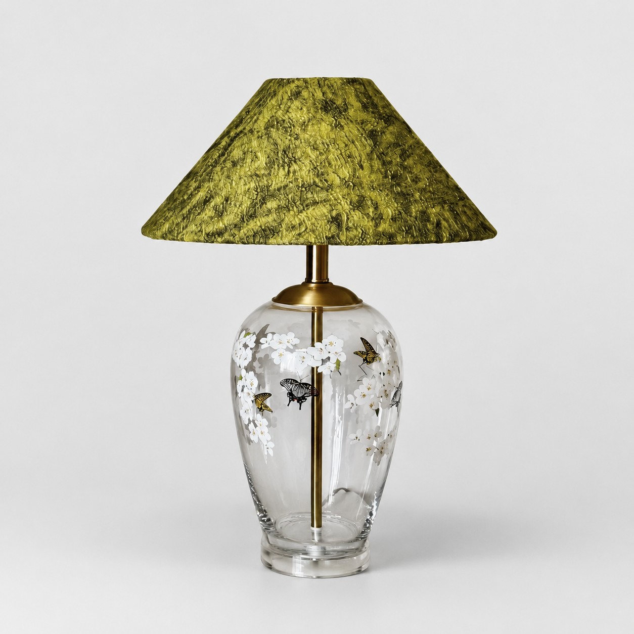 Floral glass table lamp with green textured fabric shade front view