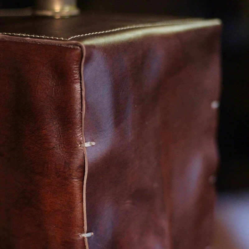 Leather texture and stitched edge detail