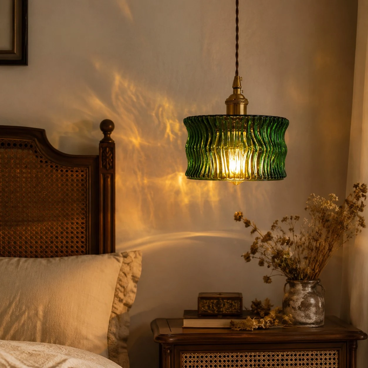 Zielony ripple glass pendant light glowing beside a bed