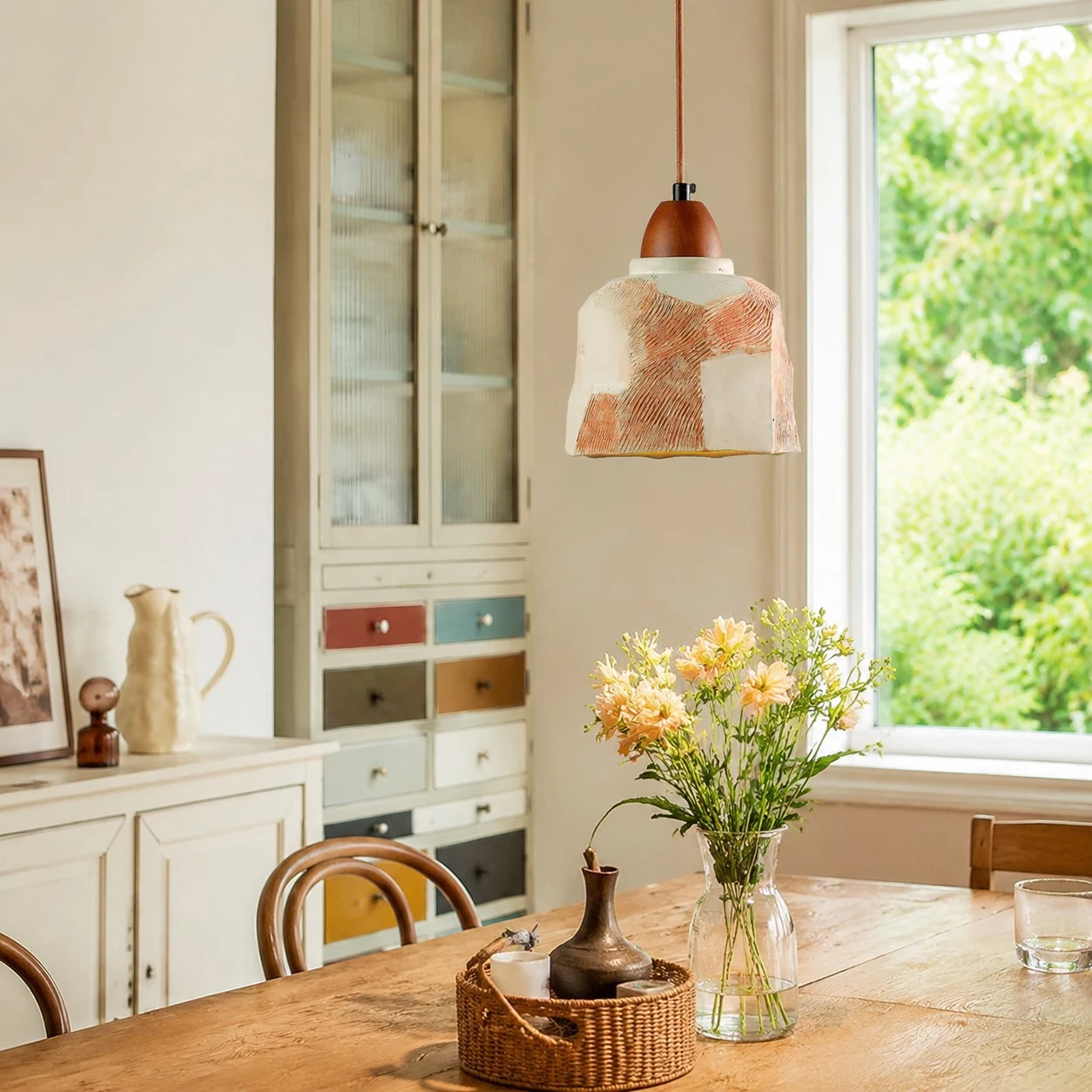 Pendant light over a bright dining table
